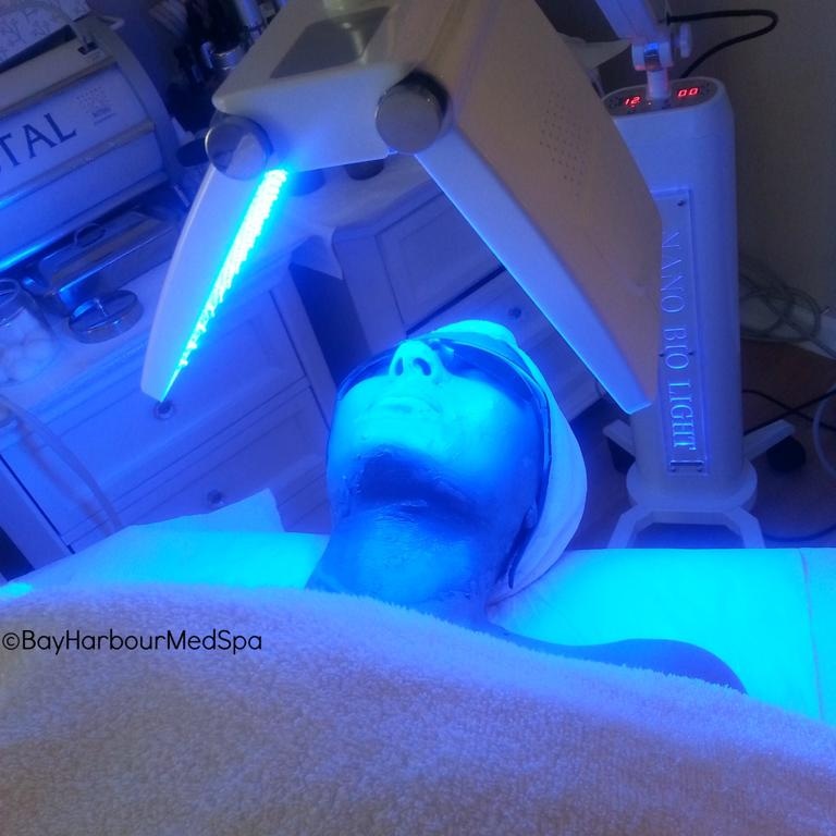 Blue LED light therapy treatment on the face